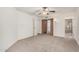 Large bedroom with carpet, storage closets and en suite bath with glass shower at 10419 W Loma Blanca Dr, Sun City, AZ 85351
