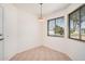Charming breakfast nook with tiled floor and bright window overlooking the yard at 10419 W Loma Blanca Dr, Sun City, AZ 85351