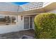 Inviting front entrance with a security screen door and established landscaping at 10419 W Loma Blanca Dr, Sun City, AZ 85351