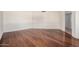 Spacious living room featuring hardwood floors and neutral color palette at 10419 W Loma Blanca Dr, Sun City, AZ 85351