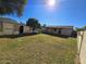 Expansive backyard features lush green grass and mature trees and an outbuilding at 10633 N 46Th Ave, Glendale, AZ 85304