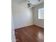 A cozy bedroom featuring wood-like flooring and a window with blinds at 10633 N 46Th Ave, Glendale, AZ 85304