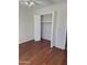 Bedroom features wood-look flooring and double closet at 10633 N 46Th Ave, Glendale, AZ 85304