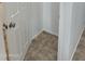 Small walk-in closet with tile flooring at 10633 N 46Th Ave, Glendale, AZ 85304