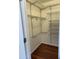 Walk-in closet with wire shelving and wood-look flooring at 10633 N 46Th Ave, Glendale, AZ 85304
