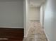 Inviting hallway with tile flooring and fresh neutral paint, seamlessly connecting living spaces at 10633 N 46Th Ave, Glendale, AZ 85304