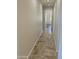 Hallway with tile flooring and neutral walls at 10633 N 46Th Ave, Glendale, AZ 85304