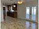Eat-in kitchen featuring stylish granite countertops, dark wood cabinets, and tile flooring at 10633 N 46Th Ave, Glendale, AZ 85304