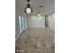 Spacious living room featuring tile floors, fresh paint, and a ceiling fan for added comfort at 10633 N 46Th Ave, Glendale, AZ 85304