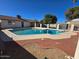 A refreshing pool is surrounded by a brick and concrete patio in the backyard at 10633 N 46Th Ave, Glendale, AZ 85304