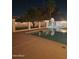 Tranquil backyard pool is illuminated at night, providing a peaceful oasis at 10633 N 46Th Ave, Glendale, AZ 85304