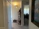 Hallway with white walls, carpet flooring, and decorative lighting at 1088 N Desert View Dr, Apache Junction, AZ 85120