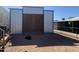 Spacious shed featuring robust wooden doors and a galvanized steel exterior, offering ample and secure storage solutions at 1088 N Desert View Dr, Apache Junction, AZ 85120