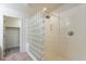 Updated shower with glass block wall and neutral wall paneling at 1088 S Storment Ln, Gilbert, AZ 85296