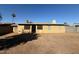 The backyard has brown dirt and a house with a metal security door at 113 W Bluefield Ave, Phoenix, AZ 85023