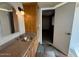 Granite counters and custom cabinetry provide a luxurious feel to this well-appointed bathroom at 113 W Bluefield Ave, Phoenix, AZ 85023