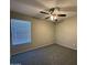 Comfortable bedroom with a ceiling fan and plush carpet, a blank canvas for your personal touch at 113 W Bluefield Ave, Phoenix, AZ 85023