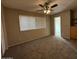 Cozy bedroom with a ceiling fan, closet, and neutral tones; a restful retreat at 113 W Bluefield Ave, Phoenix, AZ 85023