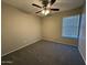 The bedroom is carpeted and has a window with horizontal blinds at 113 W Bluefield Ave, Phoenix, AZ 85023