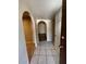 View of the entryway featuring a tiled floor and an arched hallway at 113 W Bluefield Ave, Phoenix, AZ 85023