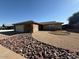 Well-kept home with tidy desert landscaping, including gravel and decorative rock and a two-car garage at 113 W Bluefield Ave, Phoenix, AZ 85023