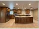 Spacious kitchen with stainless steel appliances, granite countertops, and ample cabinet space at 113 W Bluefield Ave, Phoenix, AZ 85023