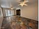 Spacious room with nice flooring and a door leading to a patio at 113 W Bluefield Ave, Phoenix, AZ 85023