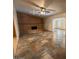 Open concept living room with beautiful tiled floors and a brick fireplace at 113 W Bluefield Ave, Phoenix, AZ 85023