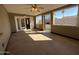 Enclosed sun room with lots of natural light and views to the backyard through large windows at 113 W Bluefield Ave, Phoenix, AZ 85023