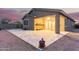Outdoor patio showcasing pavers, a covered seating area, and well-manicured landscaping at 11674 E Yeager Cyn, Gold Canyon, AZ 85118