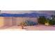 Backyard has gravel landscaping and a large bush next to block wall with mountain view at 11674 E Yeager Cyn, Gold Canyon, AZ 85118