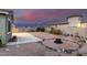 Large backyard with a fire pit, gravel landscaping, and ample space for outdoor entertainment at 11674 E Yeager Cyn, Gold Canyon, AZ 85118
