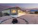 Backyard with gravel and rock border has fire pit and a view of mountains in the distance at 11674 E Yeager Cyn, Gold Canyon, AZ 85118