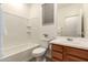 Well-lit bathroom showcasing a combined shower and tub, modern sink, and wood-look flooring at 11674 E Yeager Cyn, Gold Canyon, AZ 85118