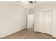 This is a spacious bedroom with hardwood floors and sliding closet doors at 11674 E Yeager Cyn, Gold Canyon, AZ 85118