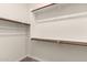 This is a walk-in closet with a lot of shelving, and poles for hanging clothing at 11674 E Yeager Cyn, Gold Canyon, AZ 85118