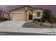 Charming single-story home featuring desert landscaping, a two-car garage, and covered porch entry at 11674 E Yeager Cyn, Gold Canyon, AZ 85118