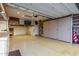 This is a garage with epoxy flooring, storage cabinets, and is well lit at 11674 E Yeager Cyn, Gold Canyon, AZ 85118