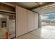 Attached garage with a large storage cabinet along the back wall and epoxy flooring at 11674 E Yeager Cyn, Gold Canyon, AZ 85118