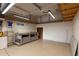 Spacious garage with epoxy flooring, an overhead light, and a work bench at 11674 E Yeager Cyn, Gold Canyon, AZ 85118