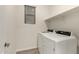 Bright laundry room with a modern washer and dryer set, a shelf, and a window at 11674 E Yeager Cyn, Gold Canyon, AZ 85118