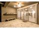 Covered patio with ceiling fan features tile flooring and sliding glass doors into home's kitchen at 11674 E Yeager Cyn, Gold Canyon, AZ 85118