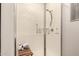 Bathroom with glass enclosed shower featuring a built in bench and towel rack at 11674 E Yeager Cyn, Gold Canyon, AZ 85118
