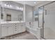 Bathroom featuring dual sinks, shower, soaking tub, and bright lighting at 12121 W Desert Moon Way, Peoria, AZ 85383