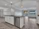 Kitchen island featuring granite countertop, stainless steel appliances, and pendant lighting at 12121 W Desert Moon Way, Peoria, AZ 85383