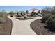 Scenic view of park walking path, ramada and playground showcasing community amenities at 13145 W Whisper Rock Trl, Peoria, AZ 85383