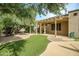 Inviting backyard oasis featuring an expansive patio and lush artificial turf at 15109 W Camino Estrella Dr, Surprise, AZ 85374