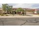 Beautiful single-story home with a desert landscape, a tile roof, and an attached garage at 15109 W Camino Estrella Dr, Surprise, AZ 85374