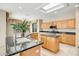 Well-lit kitchen featuring tile floors, granite countertops, stainless appliances, and a breakfast bar at 15109 W Camino Estrella Dr, Surprise, AZ 85374