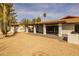 Wide open backyard with beautiful desert landscaping and a covered patio at 16414 N Dixie Mine Trl, Fountain Hills, AZ 85268